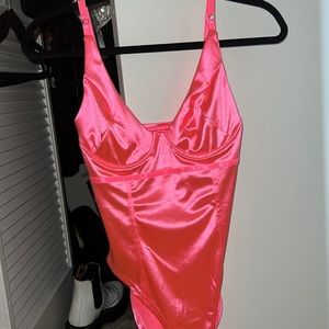 Pink bodysuit button